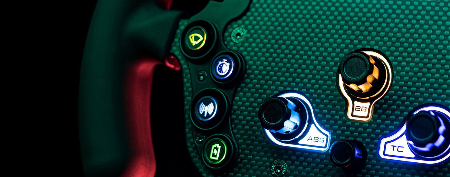 Close-up of a Simagic gaming controller with illuminated buttons on a dark background, featuring the brand 'Simagic'.